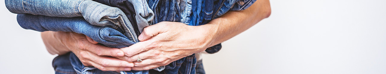 woman holding jeans