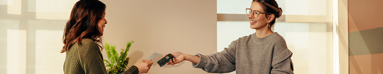 woman paying at a retail store