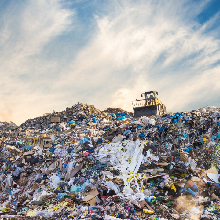 Trash dump with bulldozer