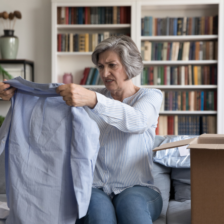 Woman unhappy with newly unboxed shirt