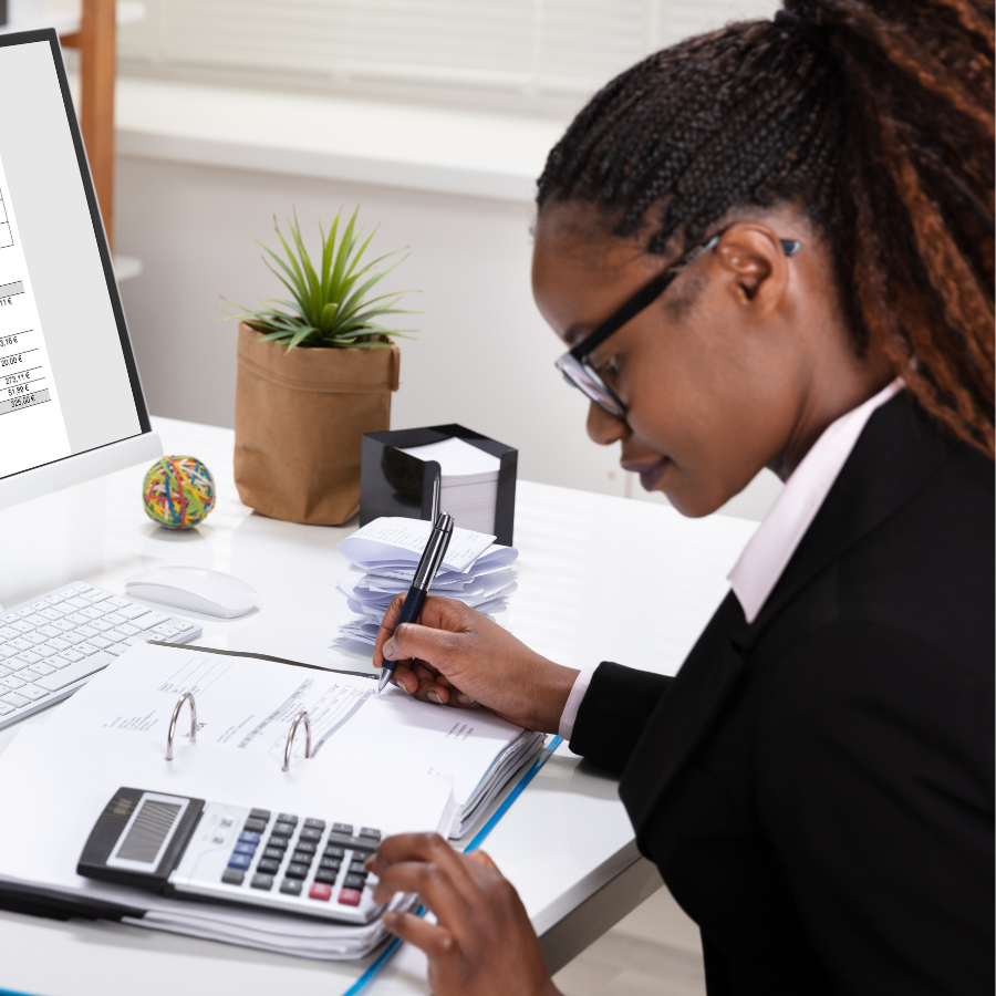 Woman at desk with calculator