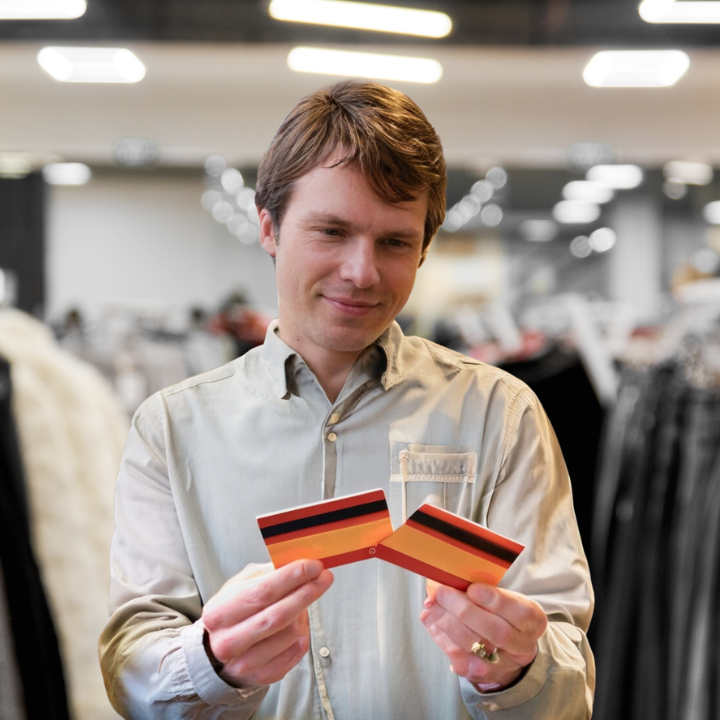 Man holding two gift cards