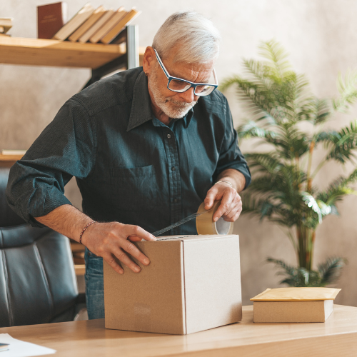 Man taping up box