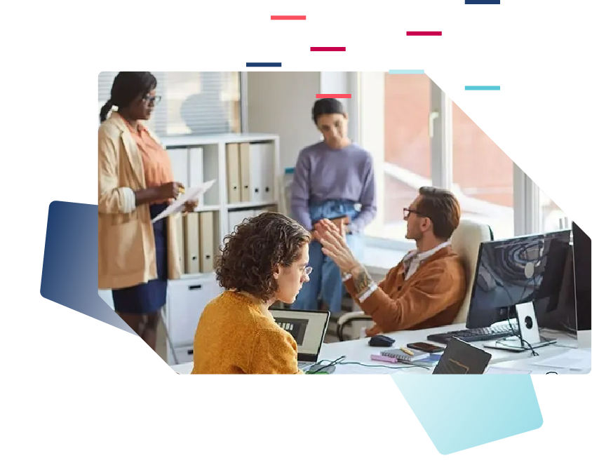 a group of business people having a discussion around their desks