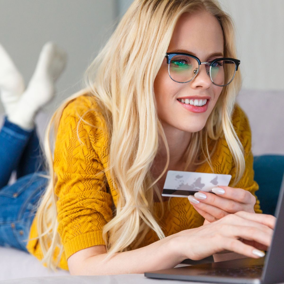 blonde-woman-shopping-online-holding-card